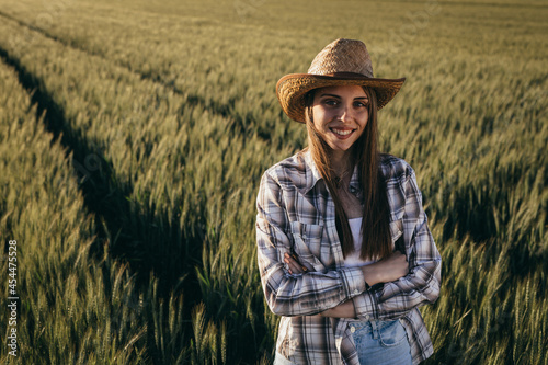 woman farmer standing in wheat field