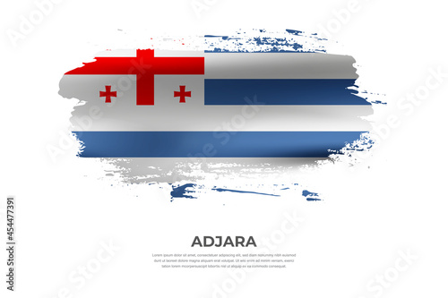 Artistic folded brush flag of Adjara. Paint smears brush stroke flag on isolated white background