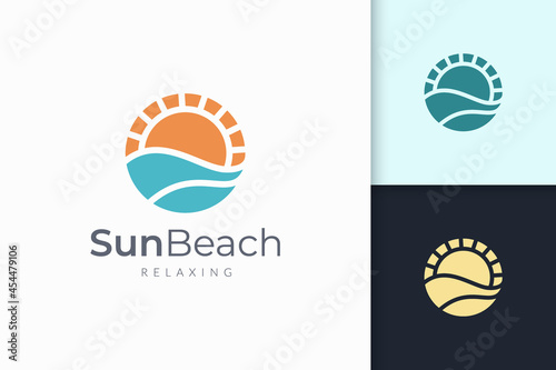 Ocean or sea logo in abstract water wave and sun represent adventure