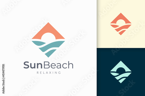 Ocean or sea logo in abstract water wave and sun represent adventure