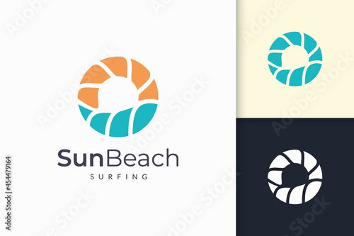 Ocean or sea logo in abstract water wave and sun represent adventure