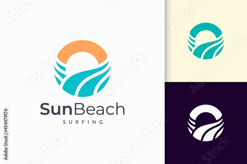 Ocean or sea logo in abstract water wave and sun represent adventure