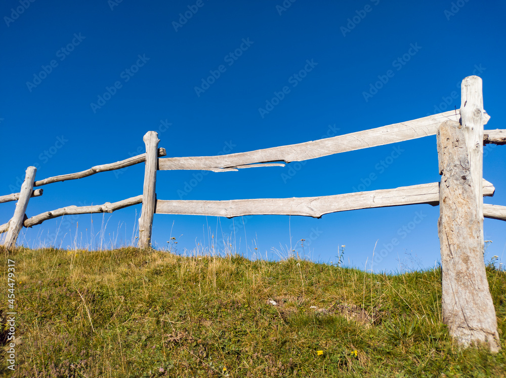 Wooden fence on a hill