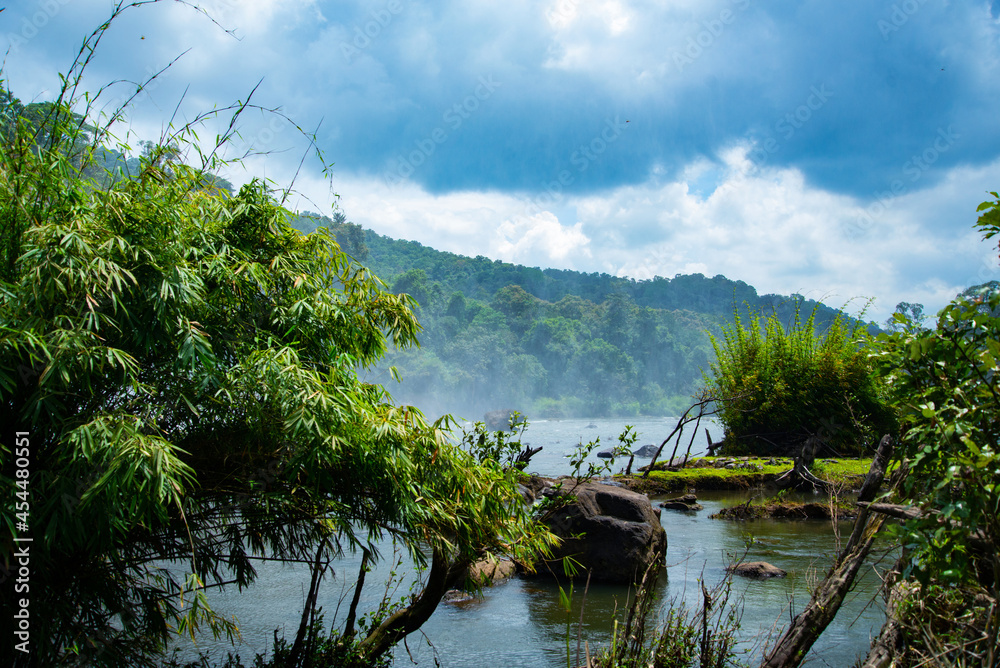 Lake landscape photography in the rain forest during the day time Athirapally waterfalls, Kerala, India