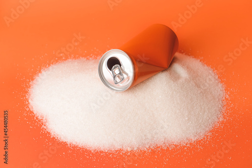 Can of soda and sugar on co...
