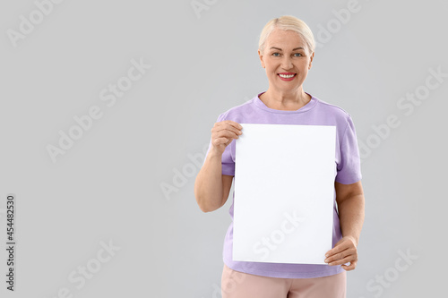 Mature woman with blank pap...