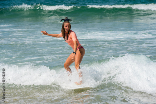 pretty young woman enjoying surfing