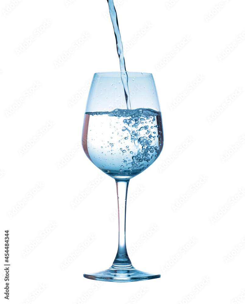 pouring water into wine glass isolated on white background pouring water into wine glass isolated on white background