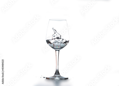 Wine glass with ice isolated on white background