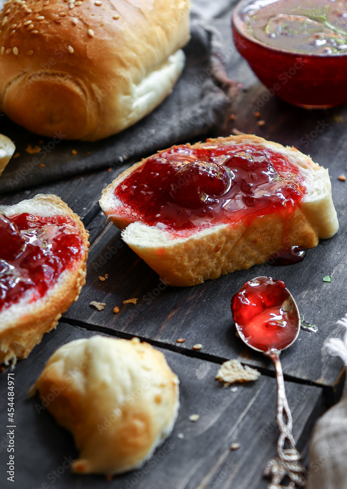 Strawberry jam. Sweet breakfast. Toast with raspberry jam and sliced croissant.