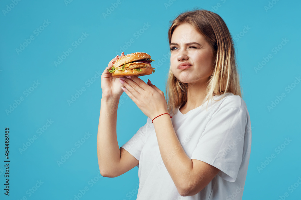blonde in white t-shirt hamburger fast food snack joy blonde in white t-shirt hamburger fast food snack joy