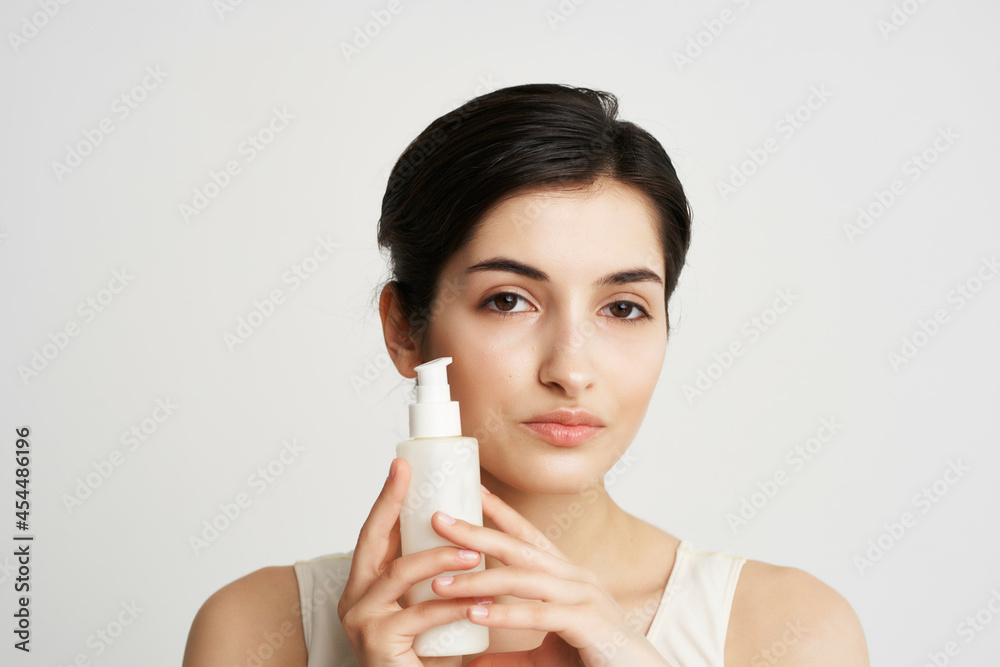 woman in white tank top body lotion clean skin rejuvenation woman in white tank top body lotion clean skin rejuvenation