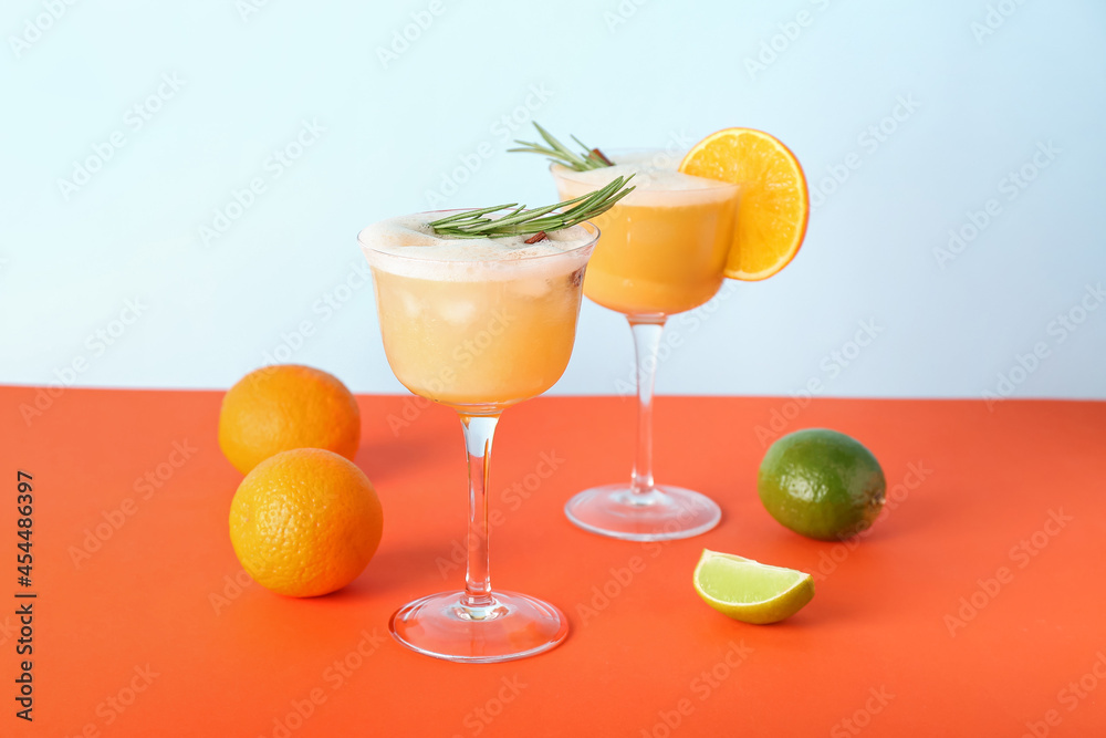 Glasses of tasty whiskey sour cocktail on color background Glasses of tasty whiskey sour cocktail on color background