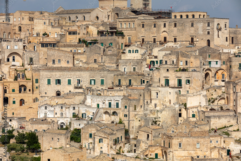 Panoramic view of Sassi di Matera a historic district in the city of Matera, well-known for their ancient cave dwellings from the Belvedere di Murgia Timone, Basilicata, Italy Panoramic view of Sassi di Matera a historic district in the city of Matera, well-known for their ancient cave dwellings from the Belvedere di Murgia Timone, Basilicata, Italy