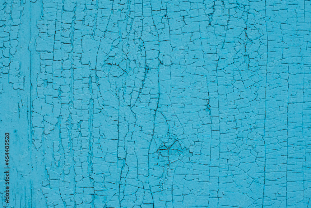 Shabby blue painted wooden wall or board with cracked paint, close-up, textured. Shabby blue painted wooden wall or board with cracked paint, close-up, textured.
