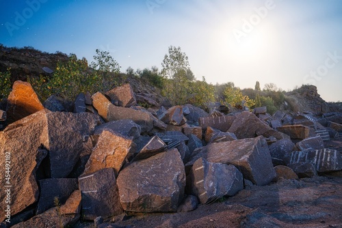 Stone materials near old flooded stone quarry