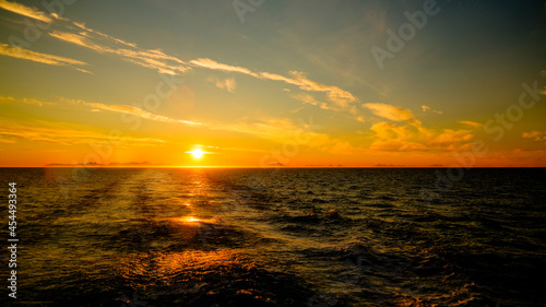 Sunset and sunrise over the sea and Lofoten archipelfgo from the Moskenes - Bodo ferry, Norway photo