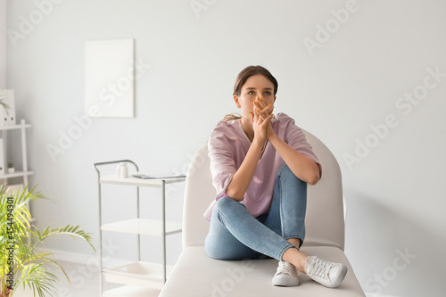 Depressed young woman in cl...