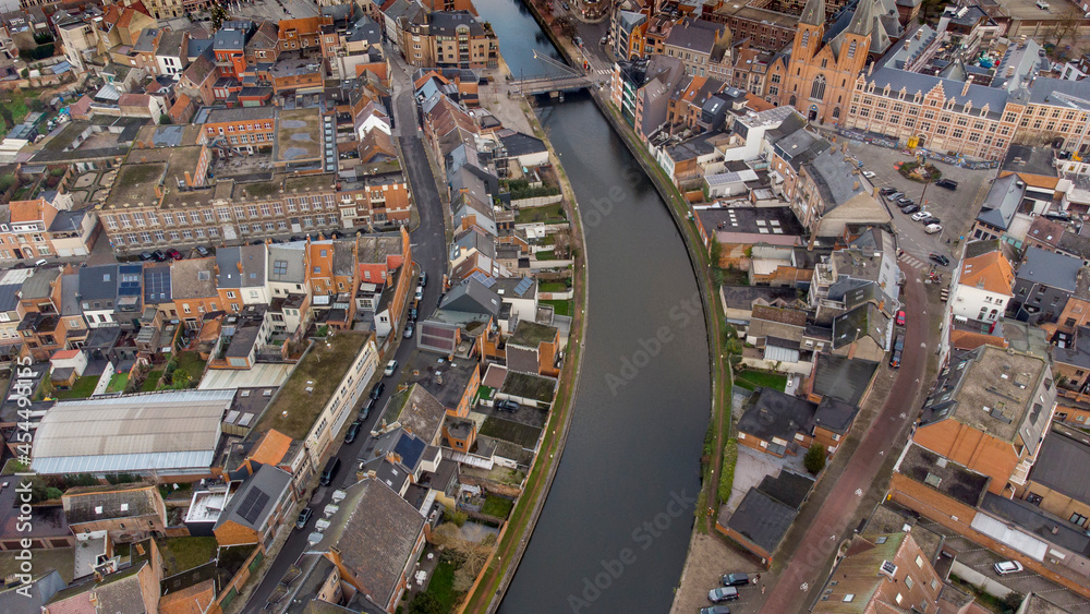 Aerial view of the Dender river crossing the Flemish city of Dendermonde