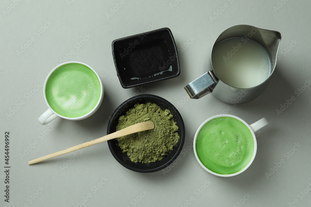 Matcha latte and accessories for making on light gray background Matcha latte and accessories for making on light gray background