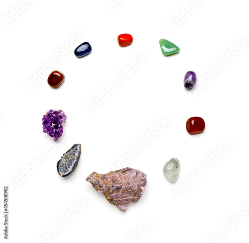 Foto Set of chakra stones on white background