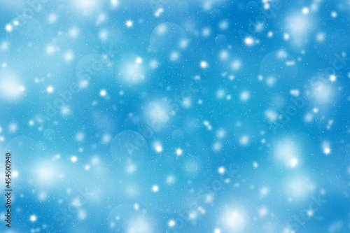 Winter abstract blue bokeh defocused background.