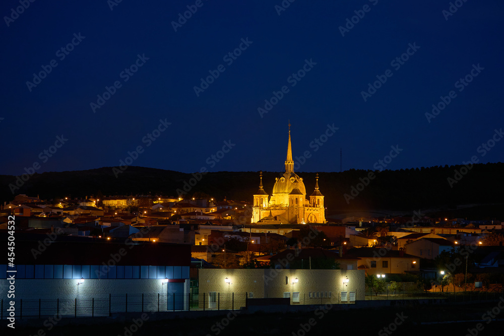 Night view of the town of San Carlos del Valle with the middle ages church of Santo Cristo illuminated with artificial lights,  Ciudad Real province, Castilla la Mancha, Spain