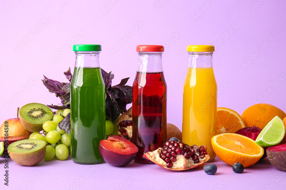 Bottles with healthy juice and fruits on color background Bottles with healthy juice and fruits on color background