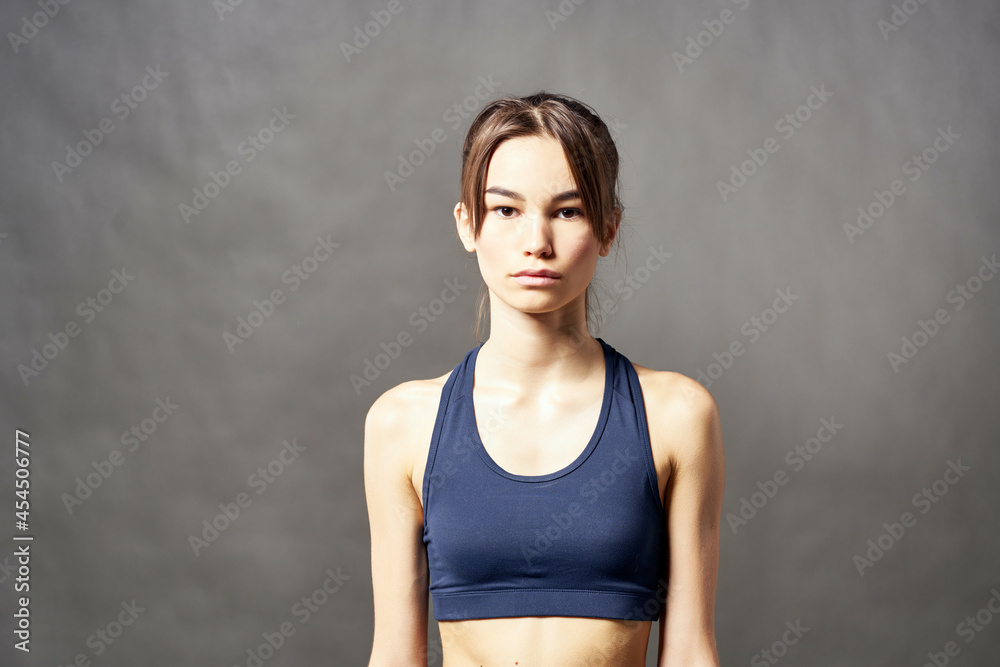 cute athletic brunette with a towel on her shoulder slim figure cute athletic brunette with a towel on her shoulder slim figure