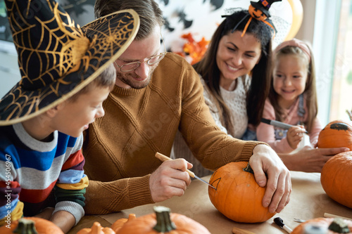 Happy family preparing to Halloween photo