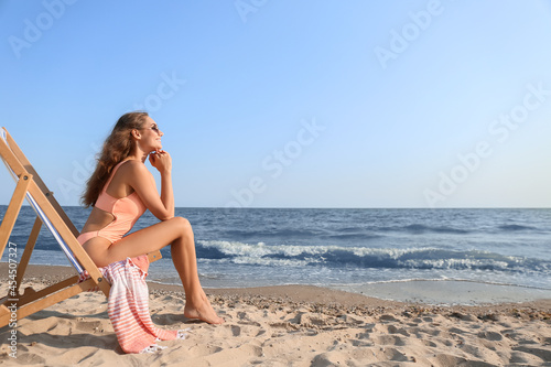 Beautiful young woman in su...