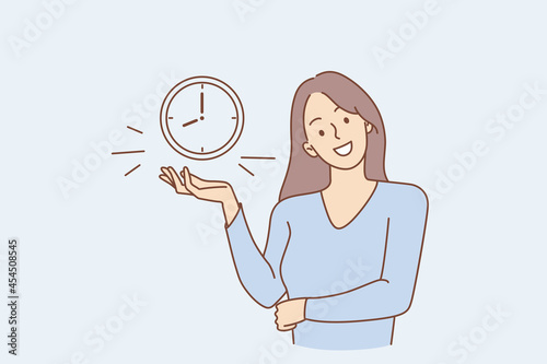Successful time management and alarm concept. Young smiling woman cartoon character standing showing alarm clock with eight hours time on it vector illustration 