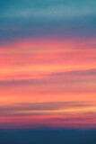 Colorful cloudy sky at sunrise - sunset. Cloudscape texture. Beautiful abstract texture in bright colors.