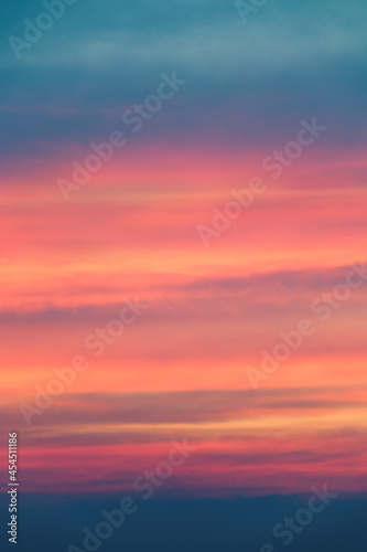 Colorful cloudy sky at sunrise - sunset. Cloudscape texture. Beautiful abstract texture in bright colors.