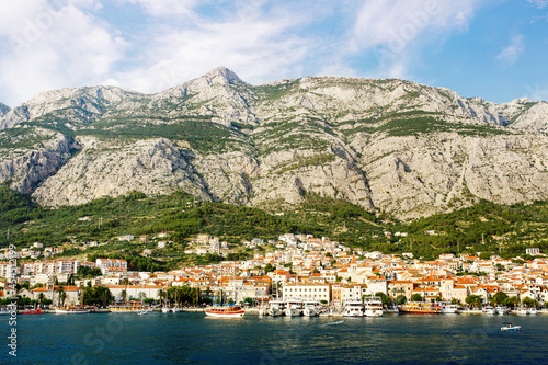 Makarska town under mountains, resort on Dalmatian coast of Adriatic sea in Croatia, croatian riviera popular location for vacations