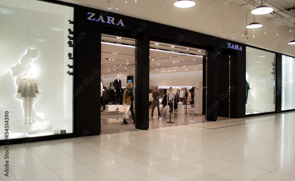 Moscow, Russia, December 2020: Entrance to the Zara store. A masked  customer comes out with her purchases Stock Photo | Adobe Stock