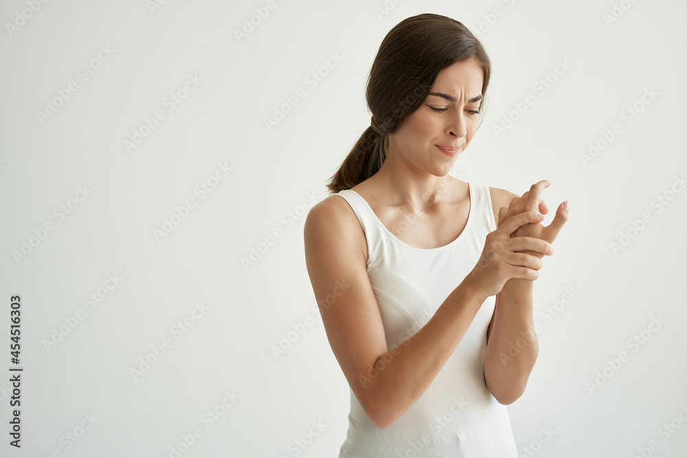 woman in white t-shirt joint pain health problems rheumatism woman in white t-shirt joint pain health problems rheumatism