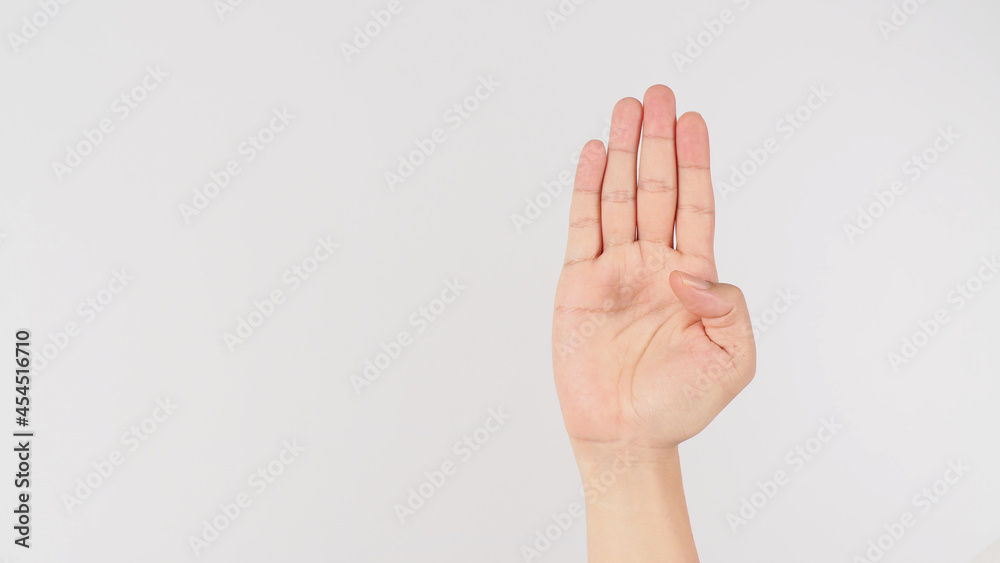 Signal for Help.Palm to camera and tuck thumb hand sign on white background. Signal for Help.Palm to camera and tuck thumb hand sign on white background.