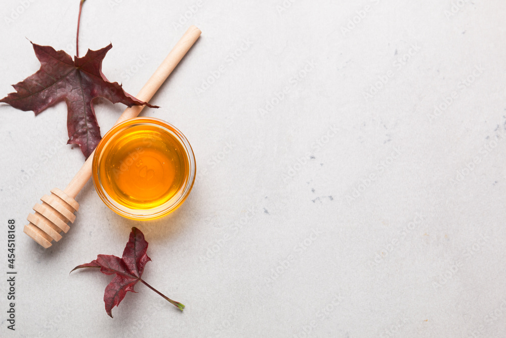 Honey or maple syrup in a bowl.
