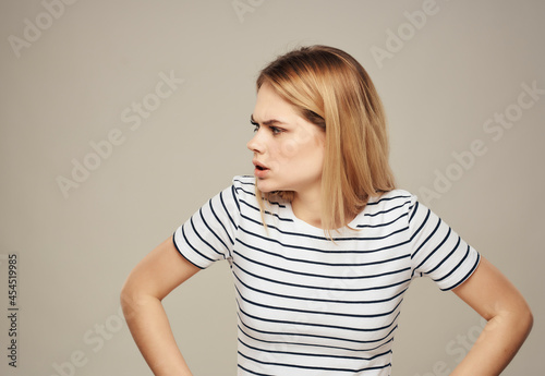 woman with angry facial expression striped t-shirt emotions Studio