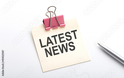 Принти на полотні LATEST NEWS text on sticker with pen on the white background