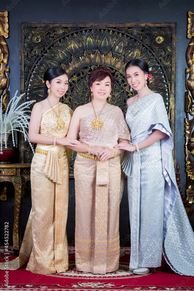 beautiful mother and pretty two daughters in Thai dress beautiful mother and pretty two daughters in Thai dress