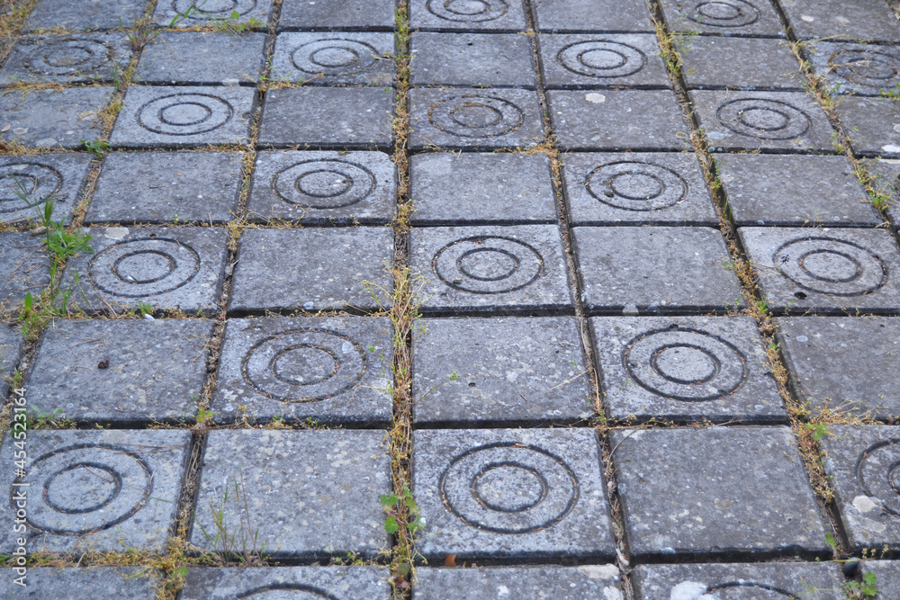 cement tiles on the sidewalk