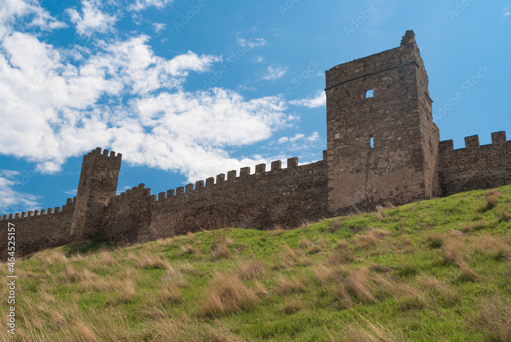 Spring landscape with wall and towers of an ancient Genoese fortress in Sudak, Crimea, Ukraine