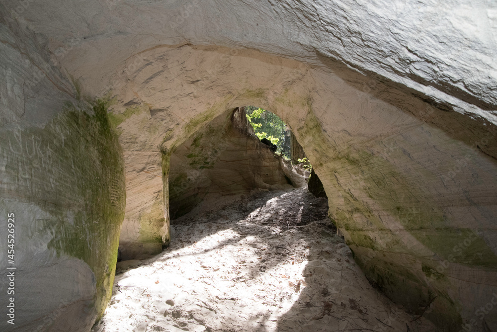 WHITE SAND CAVE IN NATURE PARK ON A SUNNY SUMMER DAY