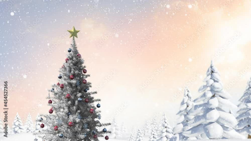 Snow falling over christmas tree and multiple snow covered trees on winter landscape Snow falling over christmas tree and multiple snow covered trees on winter landscape