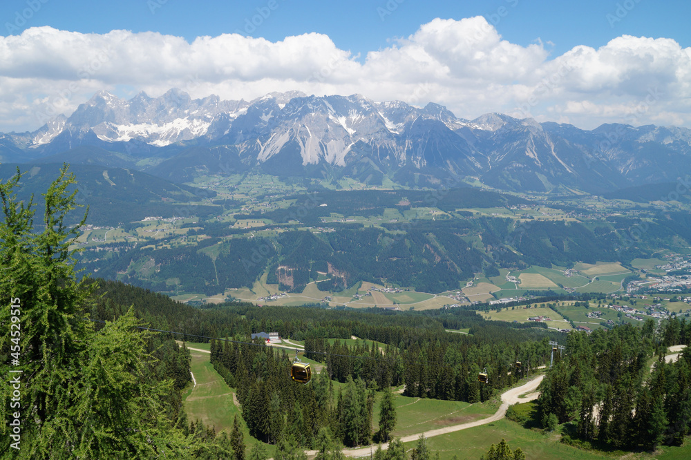 a hiking trail overlooking beautiful alpine valley surrounded by the Austrian Alps of the Schladming-Dachstein region (Austria)	
