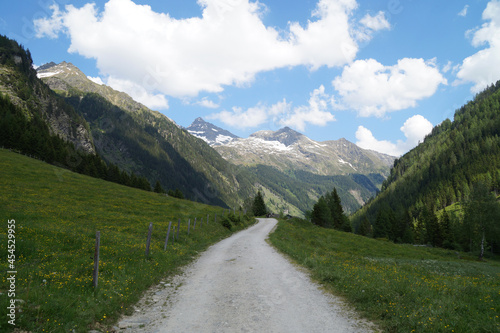 a hiking trail leading through the alpine landscape in the Schladming-Dachstein region in Austria 