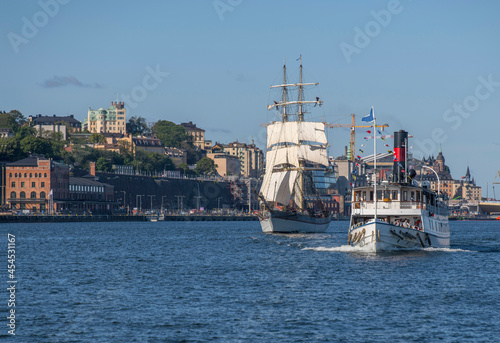 Steam ship and old sail ship Tre Kronor Af Stockholm at the Stockholm water front at Saltsjön. photo