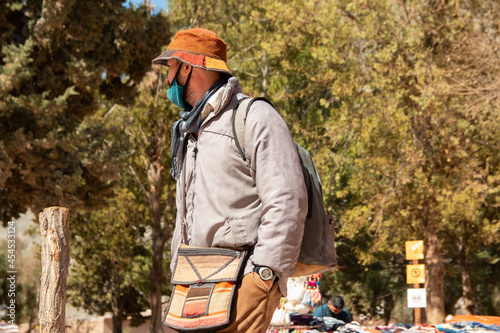 Tourist wearin backpack and bags photo